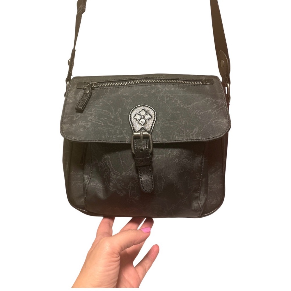 Patricia Nash black crossbody purse. Several compartments. Very versatile